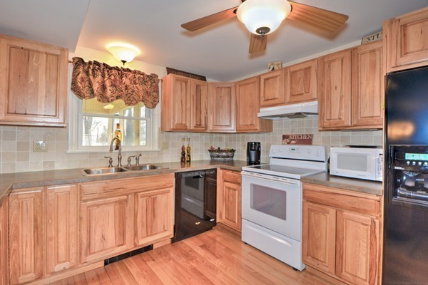 12 Williams Road Sturbridge, MA 01566 - Photo 5 of 30 a kitchen with granite countertop a sink stainless steel appliances and cabinets