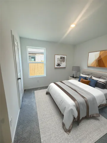 a bedroom with bed and window