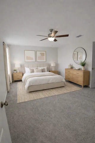 a bedroom with bed and a chandelier