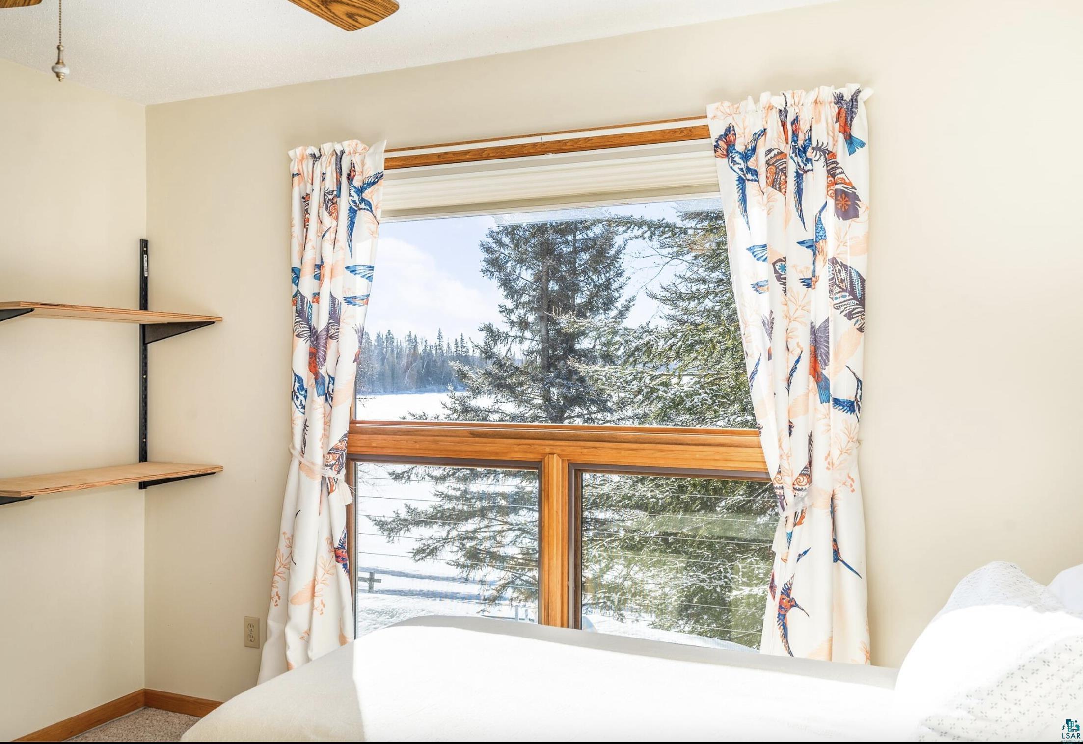 1480 Devil Track Road Grand Marais, MN 55604 - Photo 25 of 38 Bedroom featuring lake views