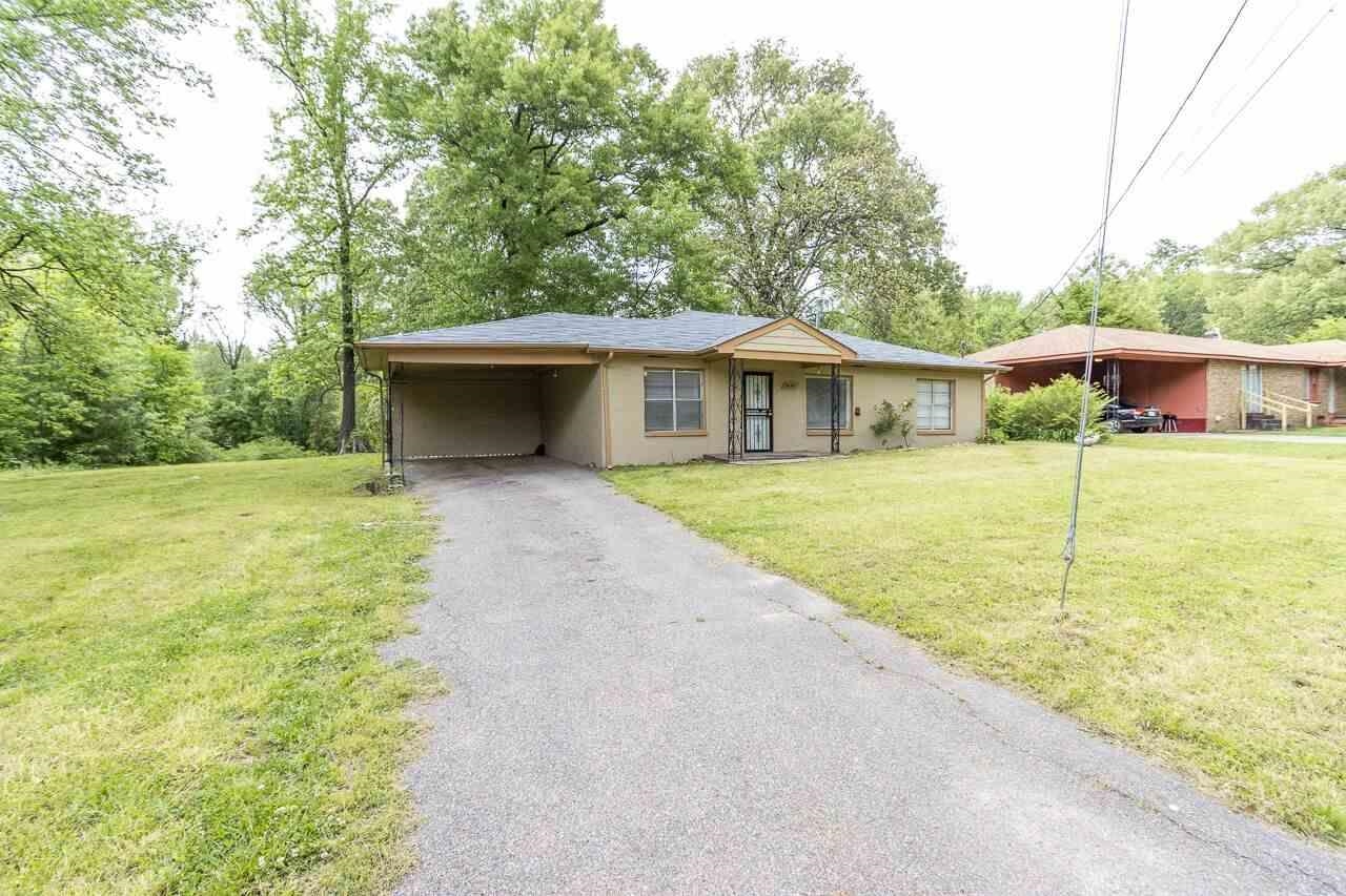 3424 Felton Road Memphis, TN 38128 - Photo 2 of 2 a front view of a house with a yard garage and outdoor seating