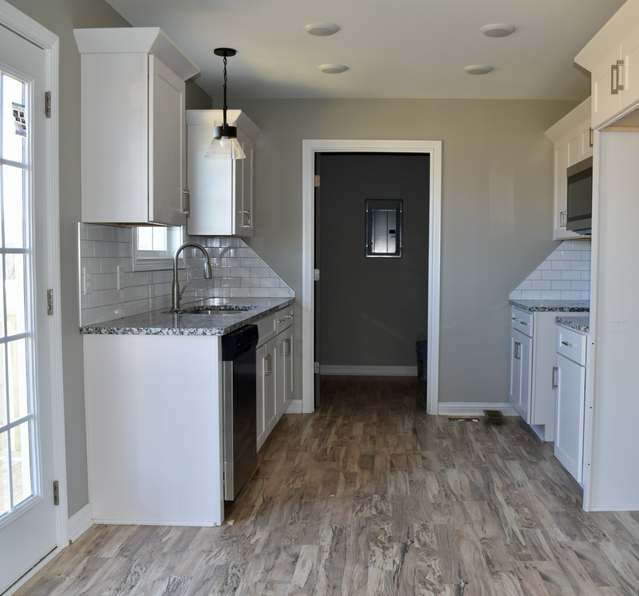459 James Whitefield Road Bethpage, TN 37022 - Photo 4 of 16 a kitchen with a sink a refrigerator freezer and a window