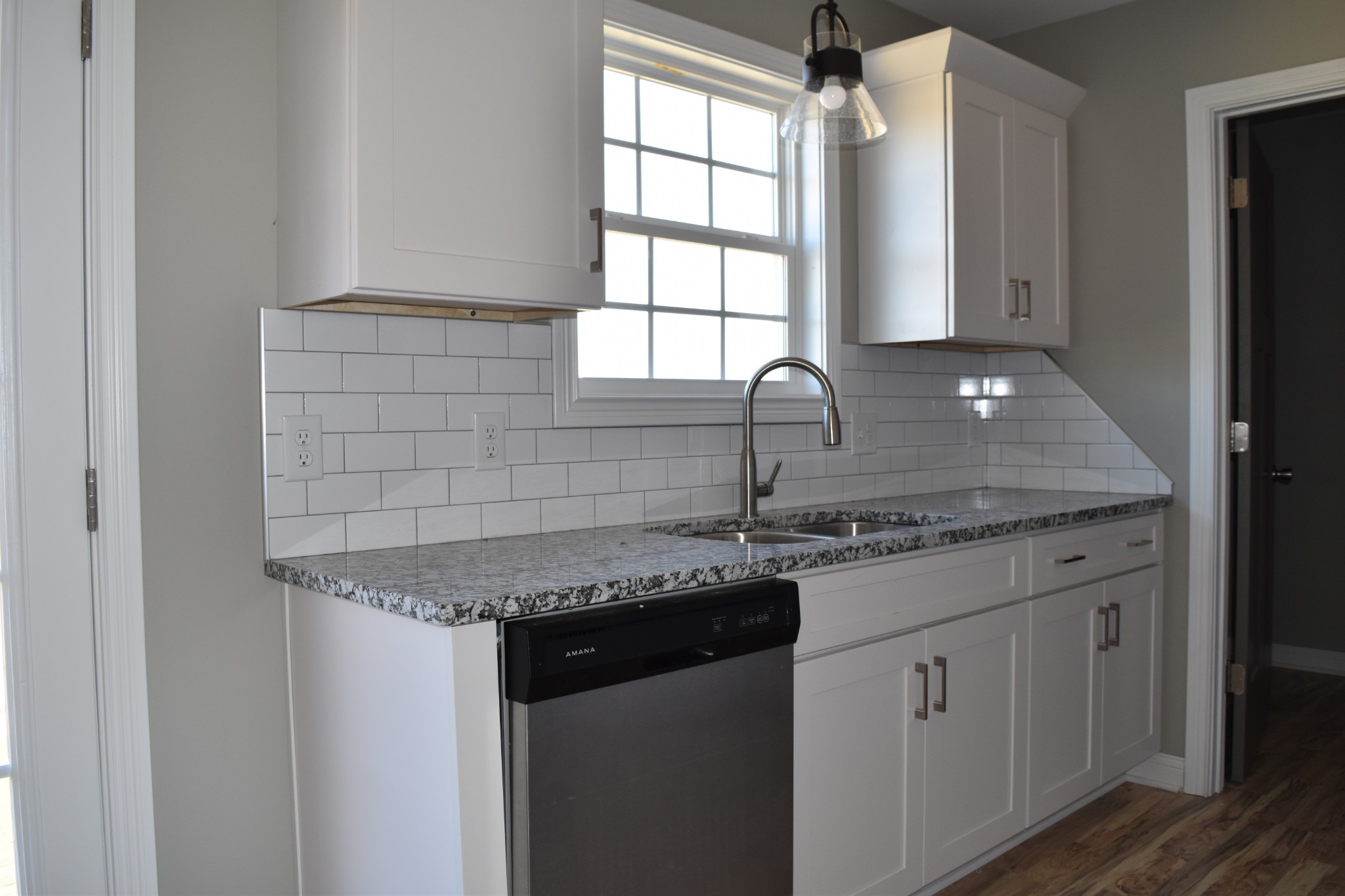 459 James Whitefield Road Bethpage, TN 37022 - Photo 5 of 16 a kitchen with granite countertop a sink and a window
