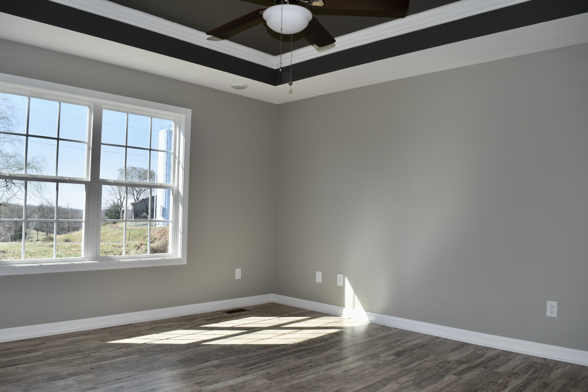 459 James Whitefield Road Bethpage, TN 37022 - Photo 8 of 16 a view of an empty room with window and wooden floor
