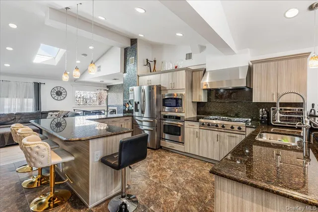 a view of a dinning table and chairs in patio of the house