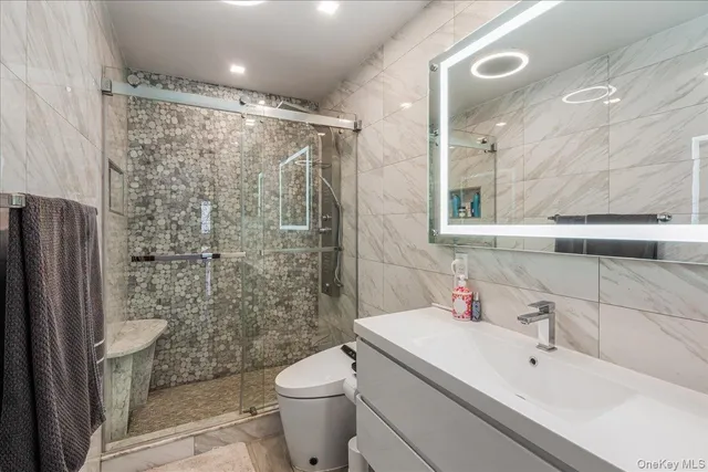 a dining room with furniture and a large window