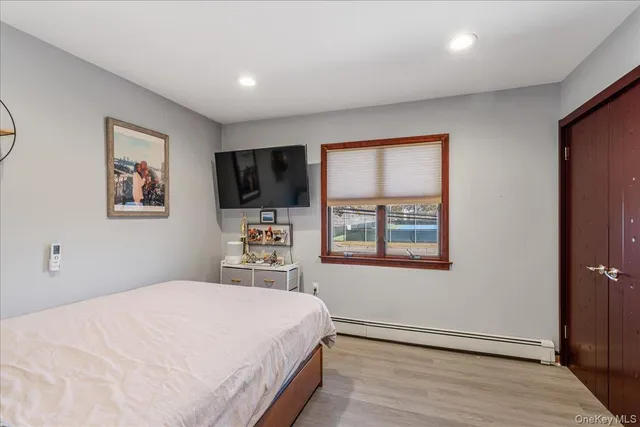 a bedroom with a bed and a table in it