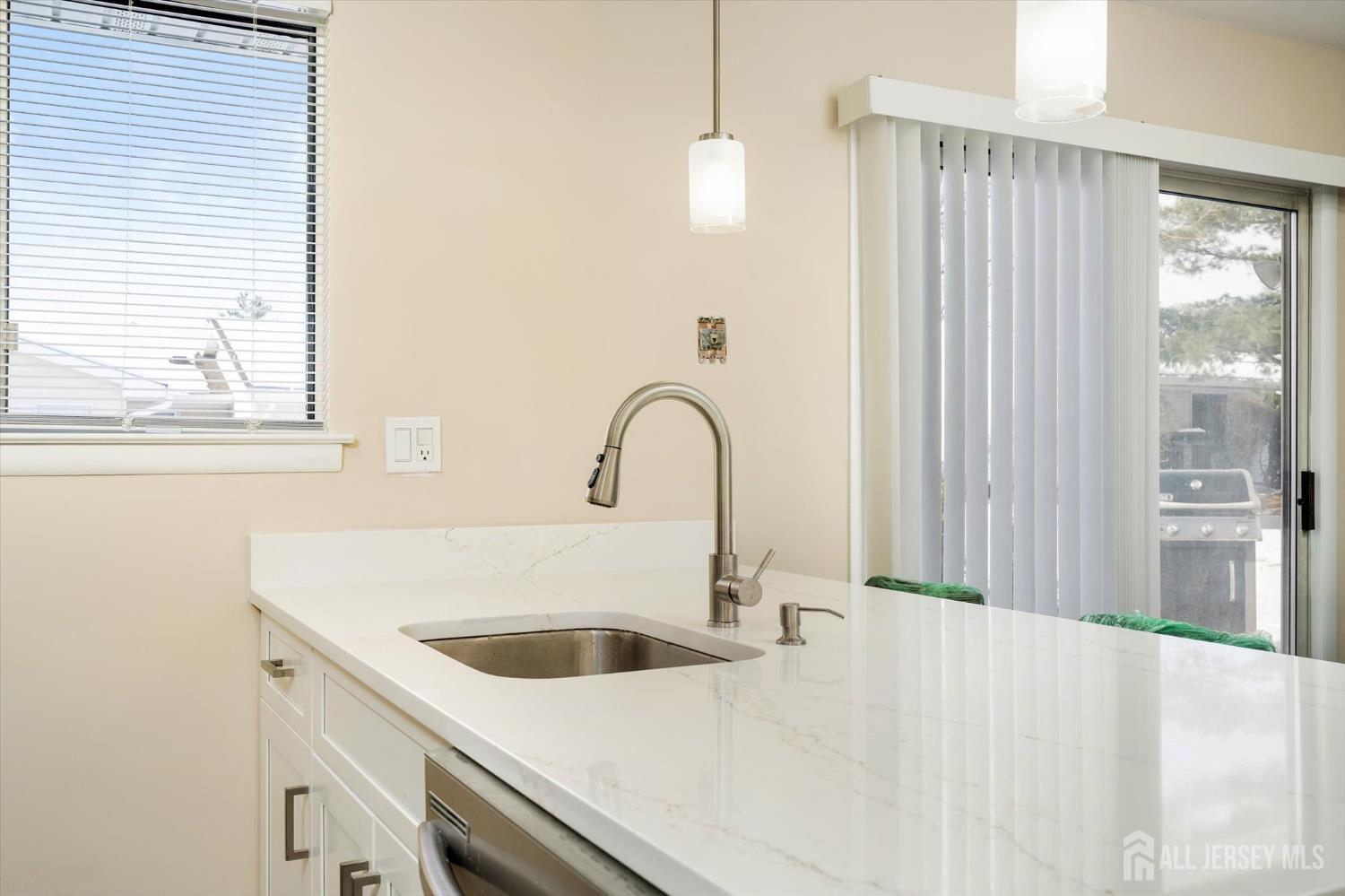 769A Marlton Road, Unit B Monroe Township, NJ 08831 - Photo 12 of 24 a close view of a sink and dishwasher with wooden floor