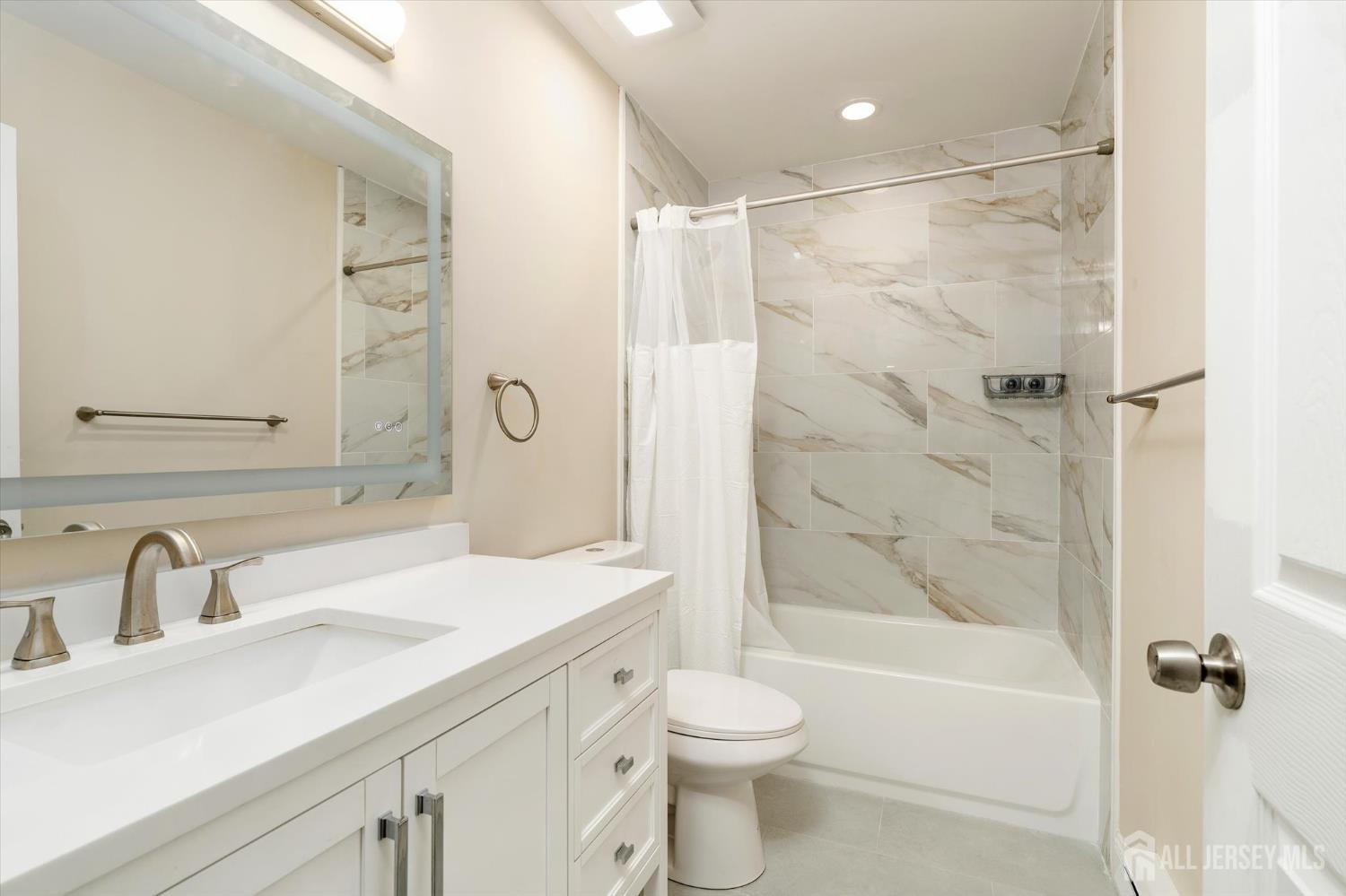 769A Marlton Road, Unit B Monroe Township, NJ 08831 - Photo 16 of 24 a bathroom with a sink toilet and shower