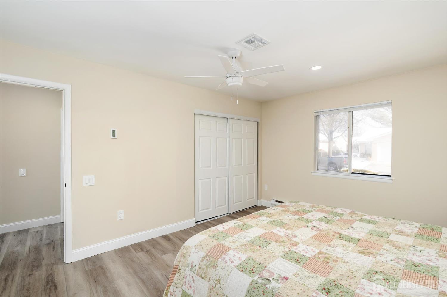 769A Marlton Road, Unit B Monroe Township, NJ 08831 - Photo 18 of 24 a view of a livingroom with a chandelier fan and wooden floor