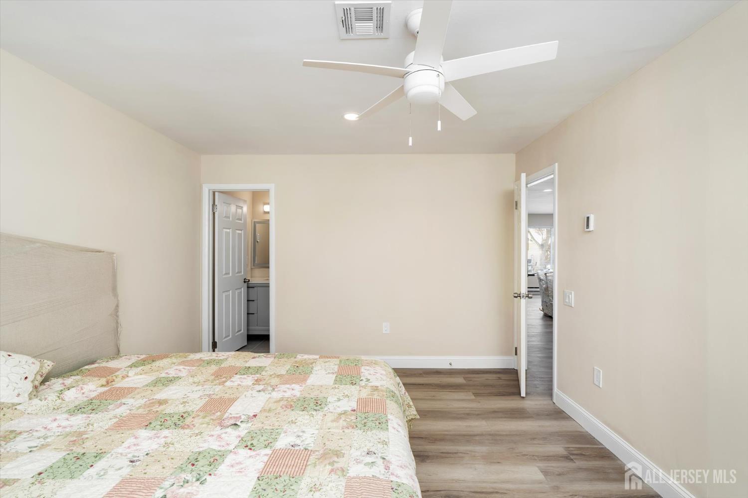 769A Marlton Road, Unit B Monroe Township, NJ 08831 - Photo 19 of 24 a view of a bedroom with wooden floor