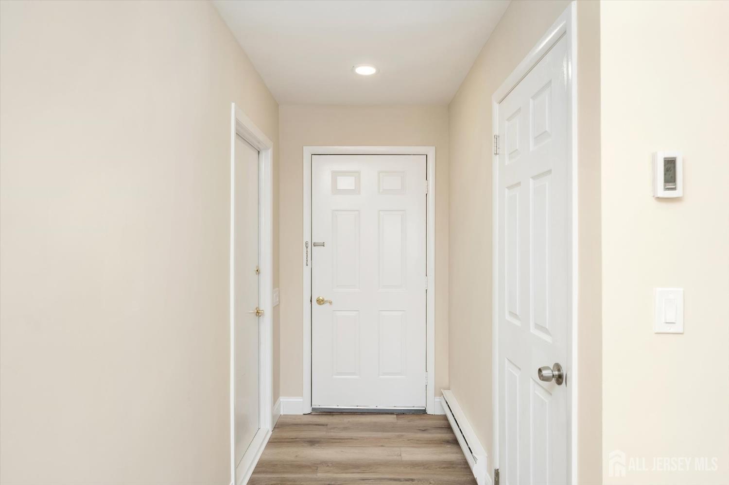 769A Marlton Road, Unit B Monroe Township, NJ 08831 - Photo 2 of 24 a view of a hallway with wooden floor