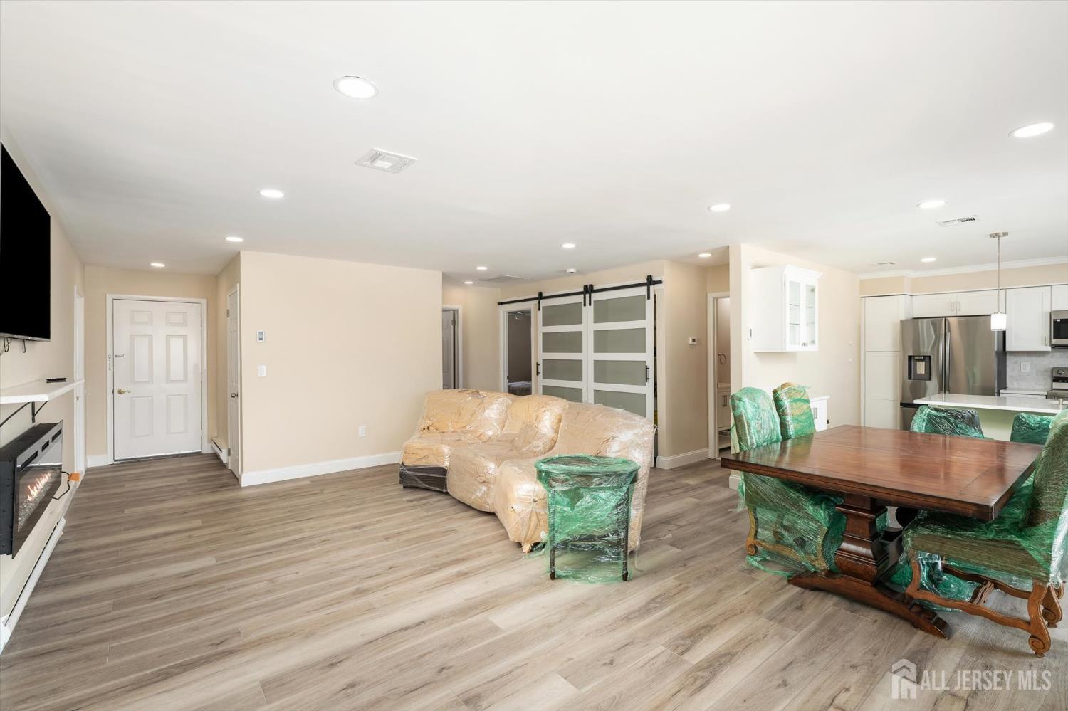 769A Marlton Road, Unit B Monroe Township, NJ 08831 - Photo 4 of 24 a living room with furniture and a wooden floor