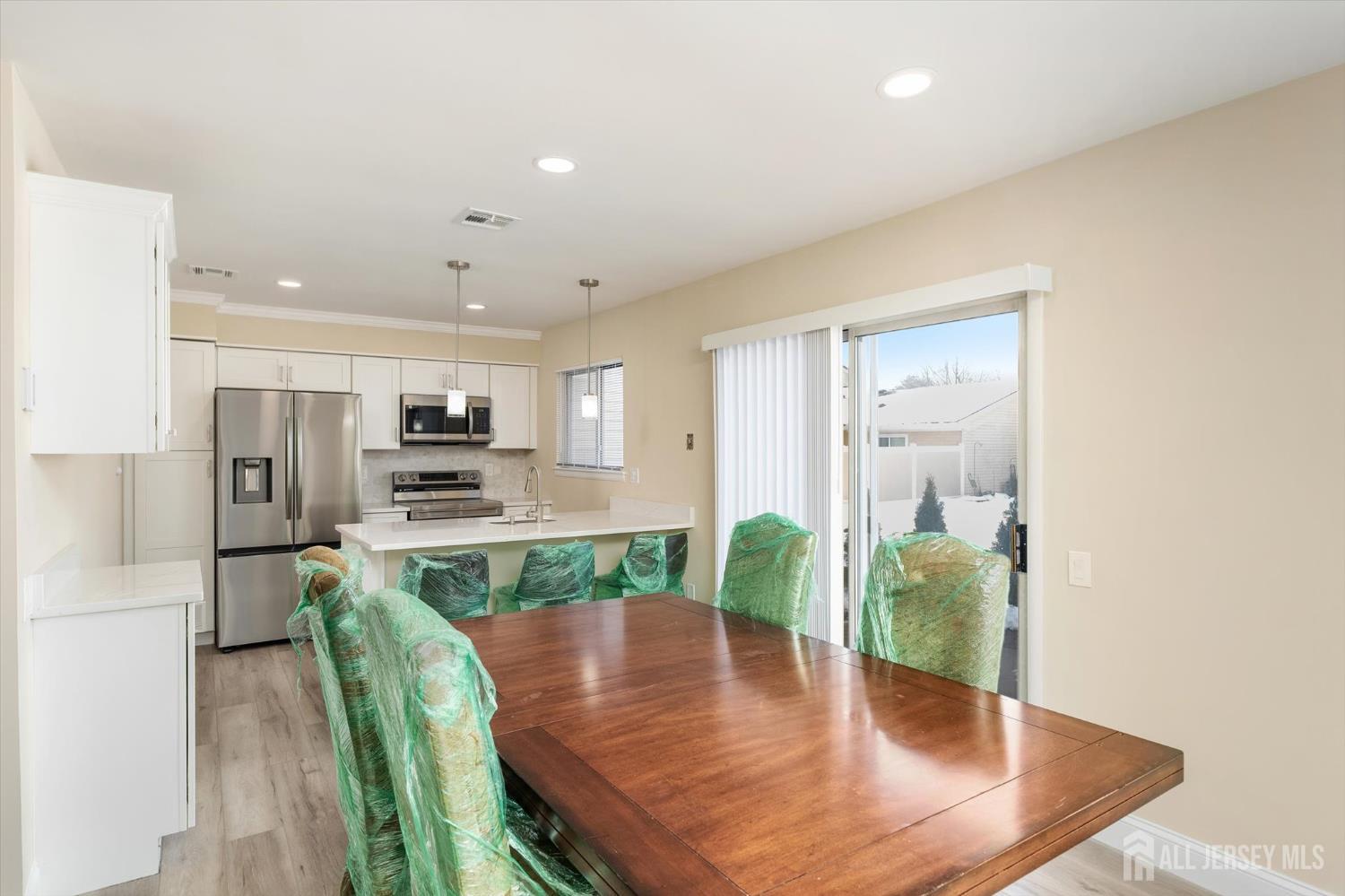 769A Marlton Road, Unit B Monroe Township, NJ 08831 - Photo 7 of 24 a view of kitchen with furniture and wooden floor