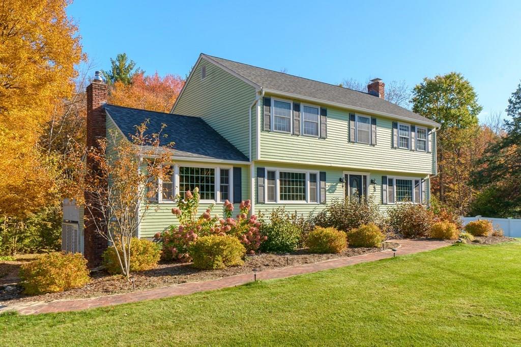 1 Fairview Drive Westford, MA 01886 - Photo 2 of 42 a front view of house with yard and trees around