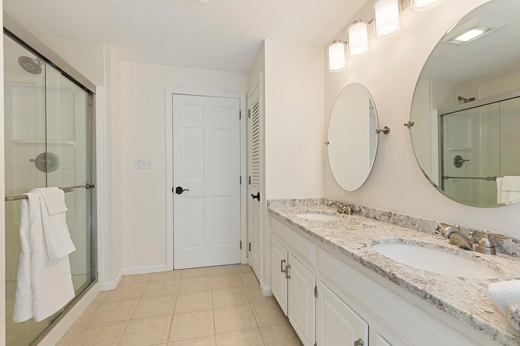 1 Fairview Drive Westford, MA 01886 - Photo 25 of 42 a bathroom with a granite countertop double vanity sink and a mirror