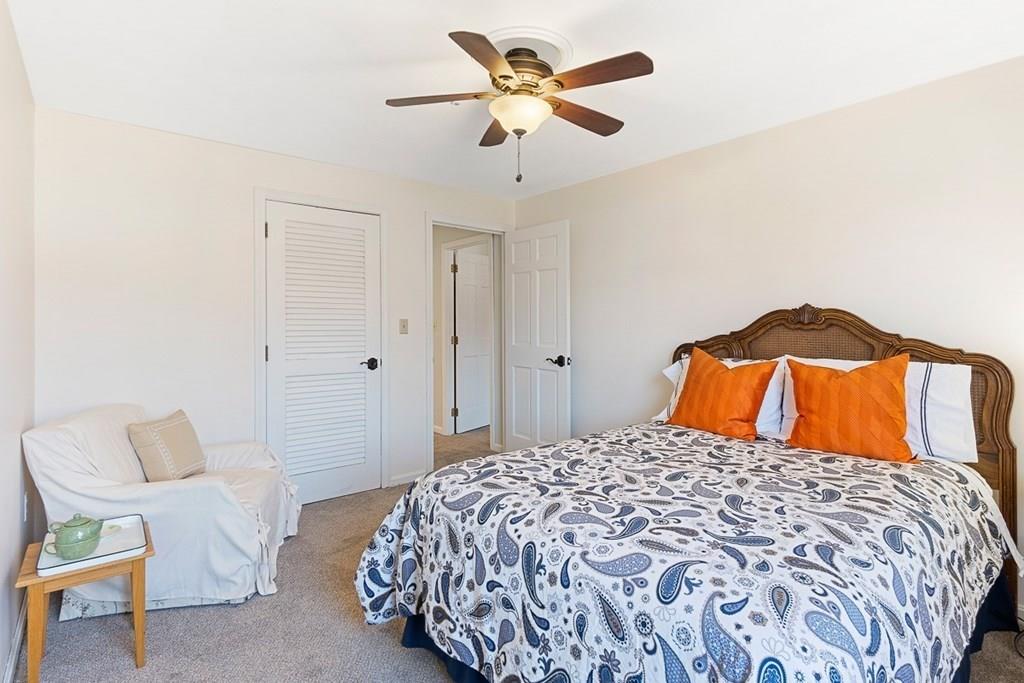 1 Fairview Drive Westford, MA 01886 - Photo 29 of 42 a bedroom with a bed and a chandelier