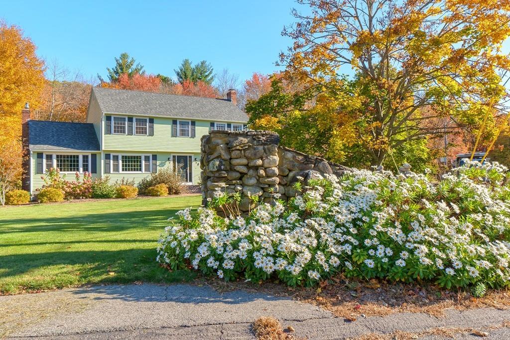 1 Fairview Drive Westford, MA 01886 - Photo 3 of 42 a front view of a house with a garden