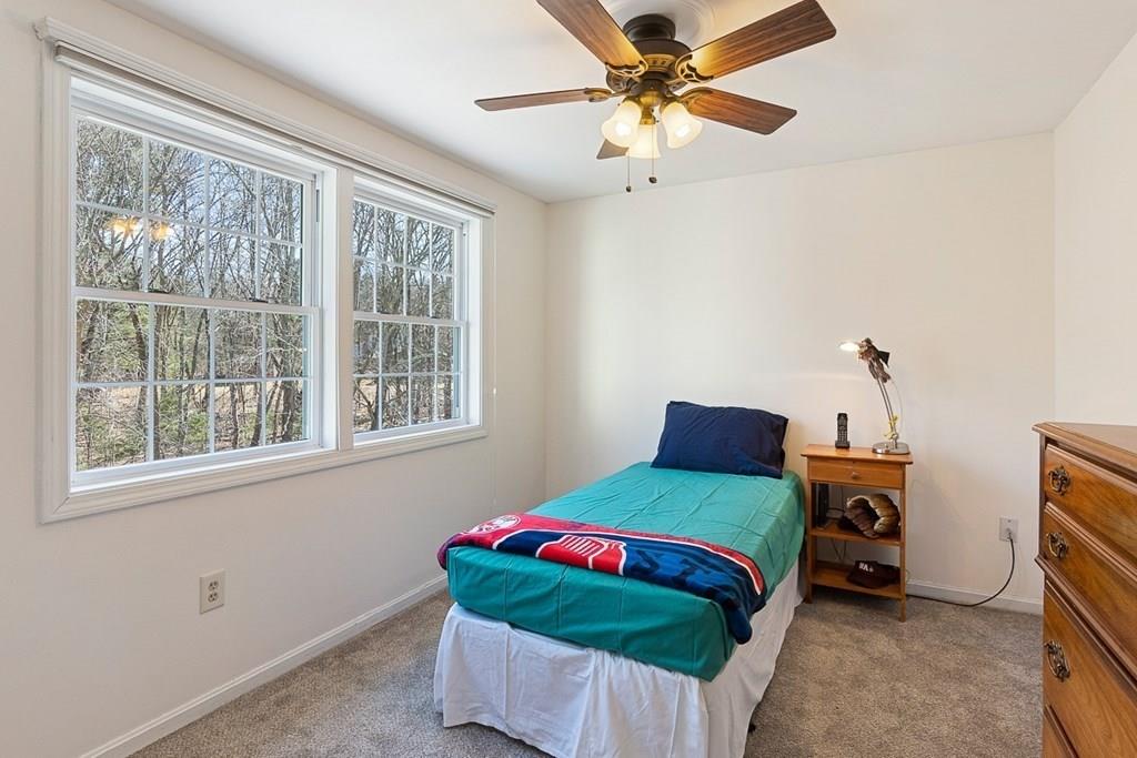 1 Fairview Drive Westford, MA 01886 - Photo 32 of 42 a bedroom with a bed and a chandelier