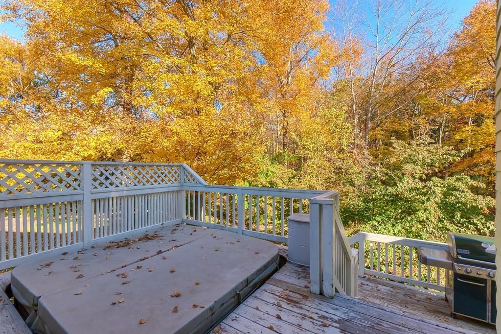 1 Fairview Drive Westford, MA 01886 - Photo 42 of 42 a view of a roof deck with wooden fence and floor