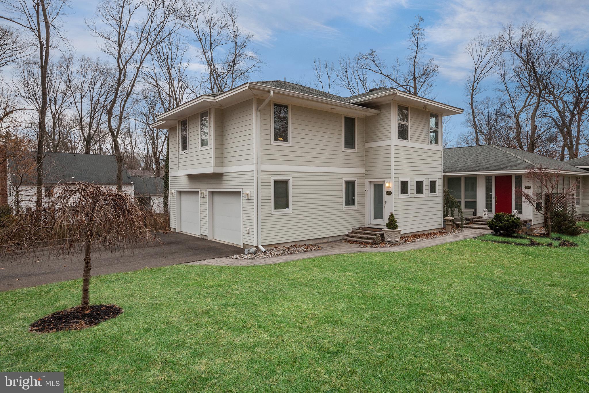 387 A Riverside Drive Princeton, NJ 08540 - Photo 1 of 23 a view of a house with a yard and sitting area
