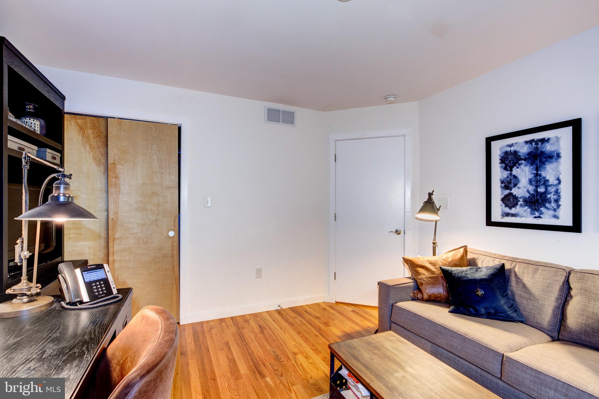 387 A Riverside Drive Princeton, NJ 08540 - Photo 22 of 23 a living room with furniture and a flat screen tv