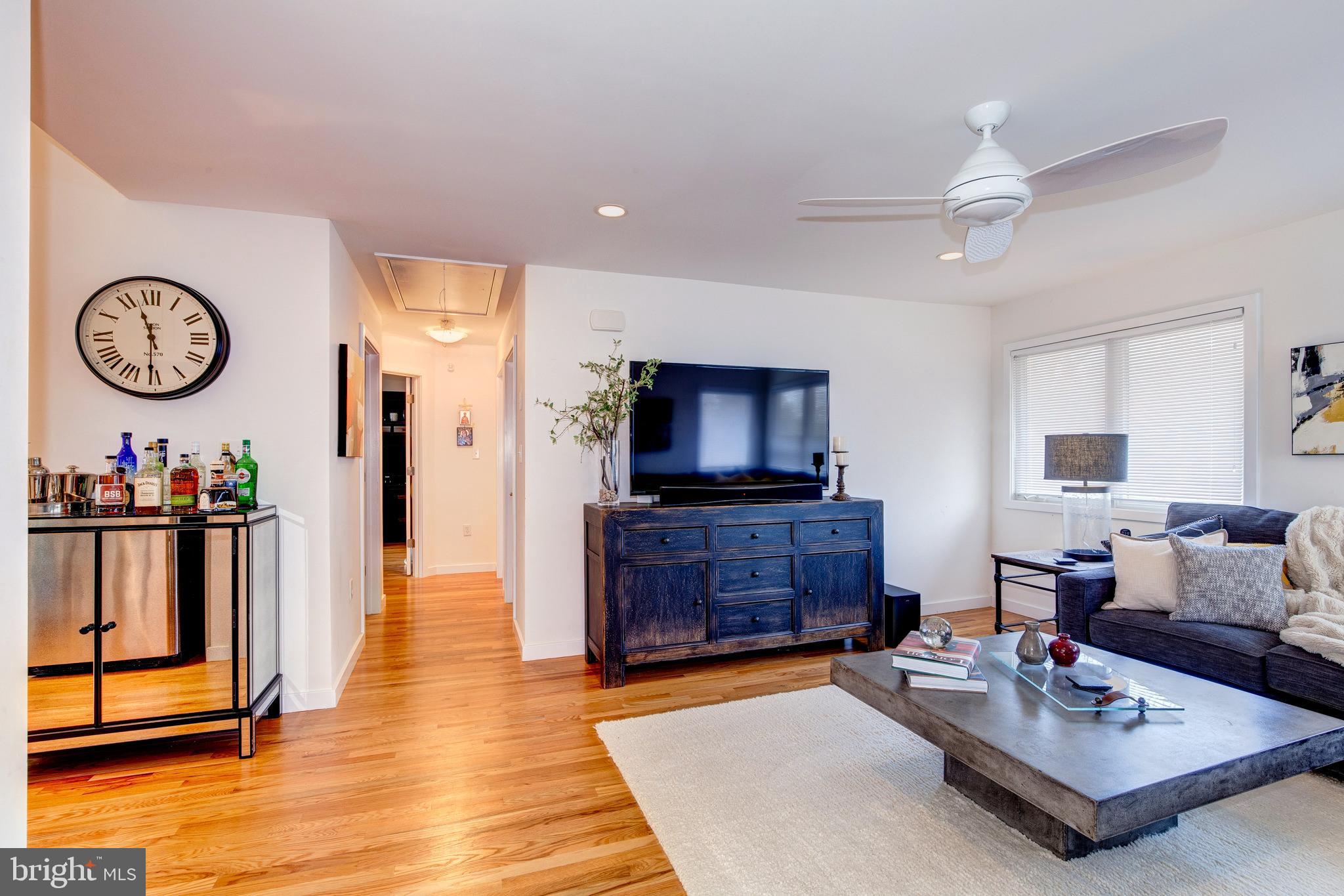 387 A Riverside Drive Princeton, NJ 08540 - Photo 5 of 23 a living room with furniture a window and a flat screen tv
