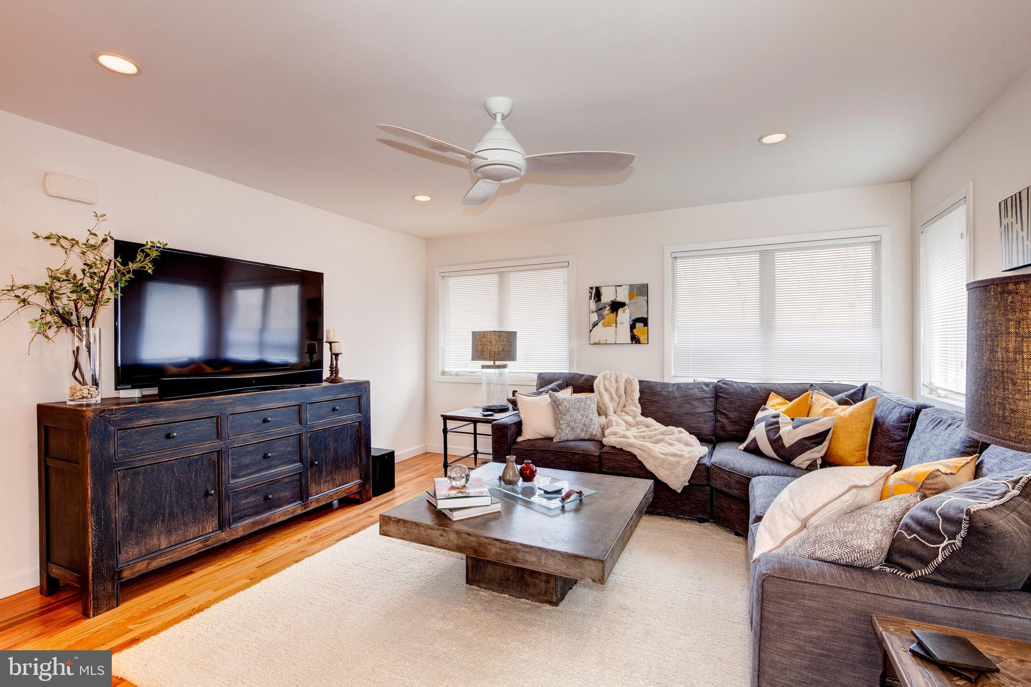 387 A Riverside Drive Princeton, NJ 08540 - Photo 6 of 23 a living room with furniture and a flat screen tv