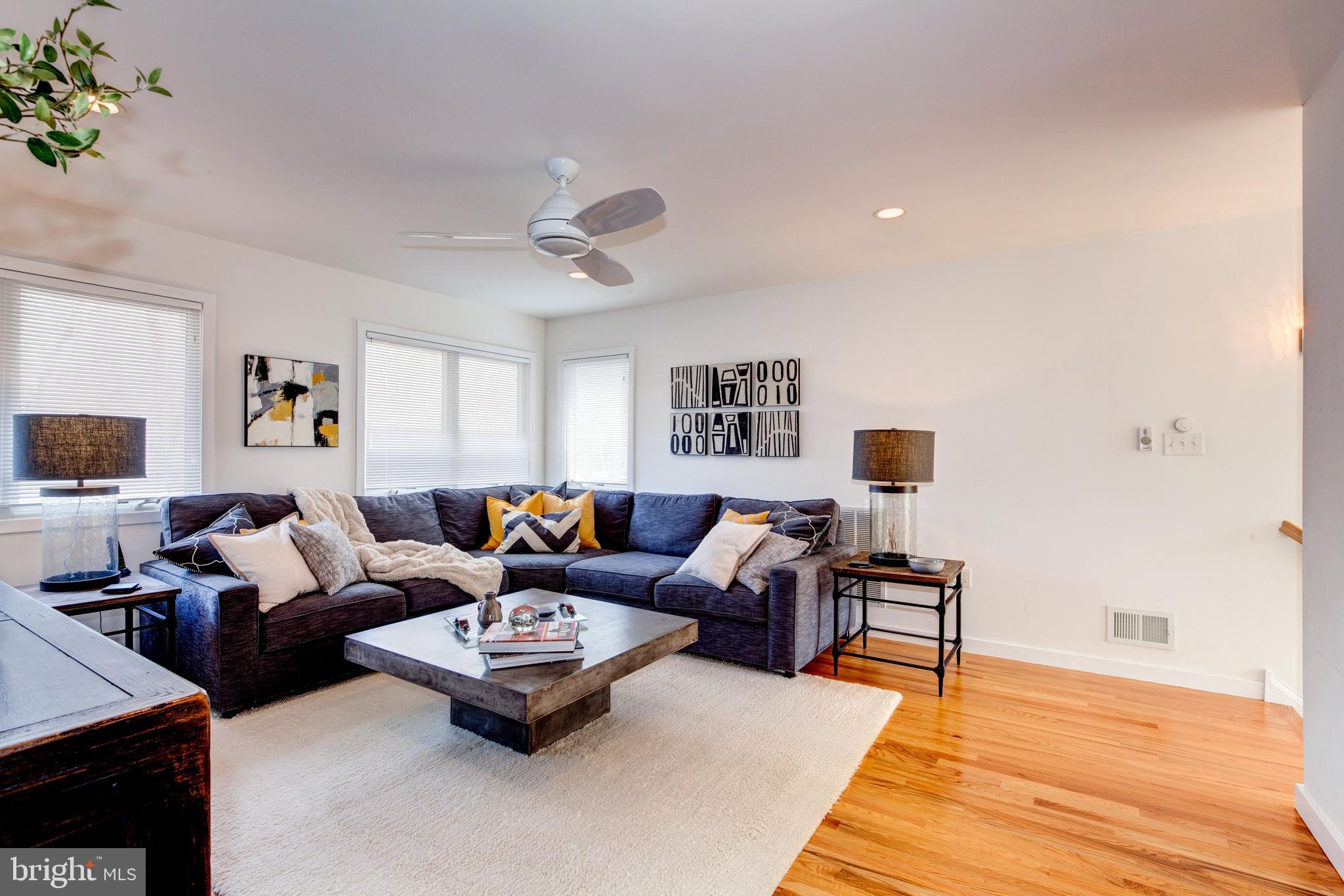 387 A Riverside Drive Princeton, NJ 08540 - Photo 8 of 23 a living room with furniture and a wooden floor