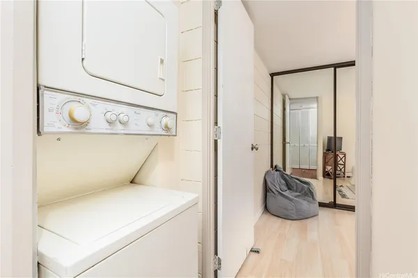 a bedroom with a bed and flat screen tv