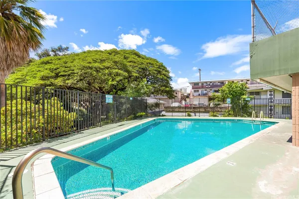 a view of swimming pool from a balcony