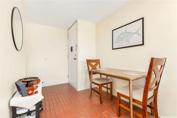 a view of a room with furniture and wooden floor