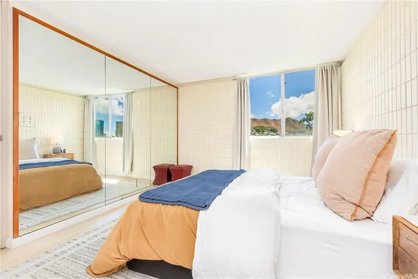a bedroom with a bed and a cabinets