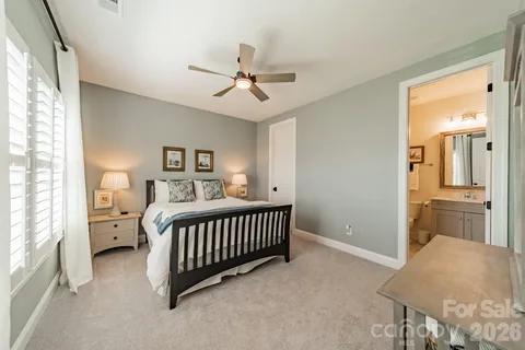 a bedroom with furniture and a window