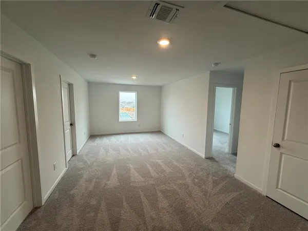 a view of an empty room and window