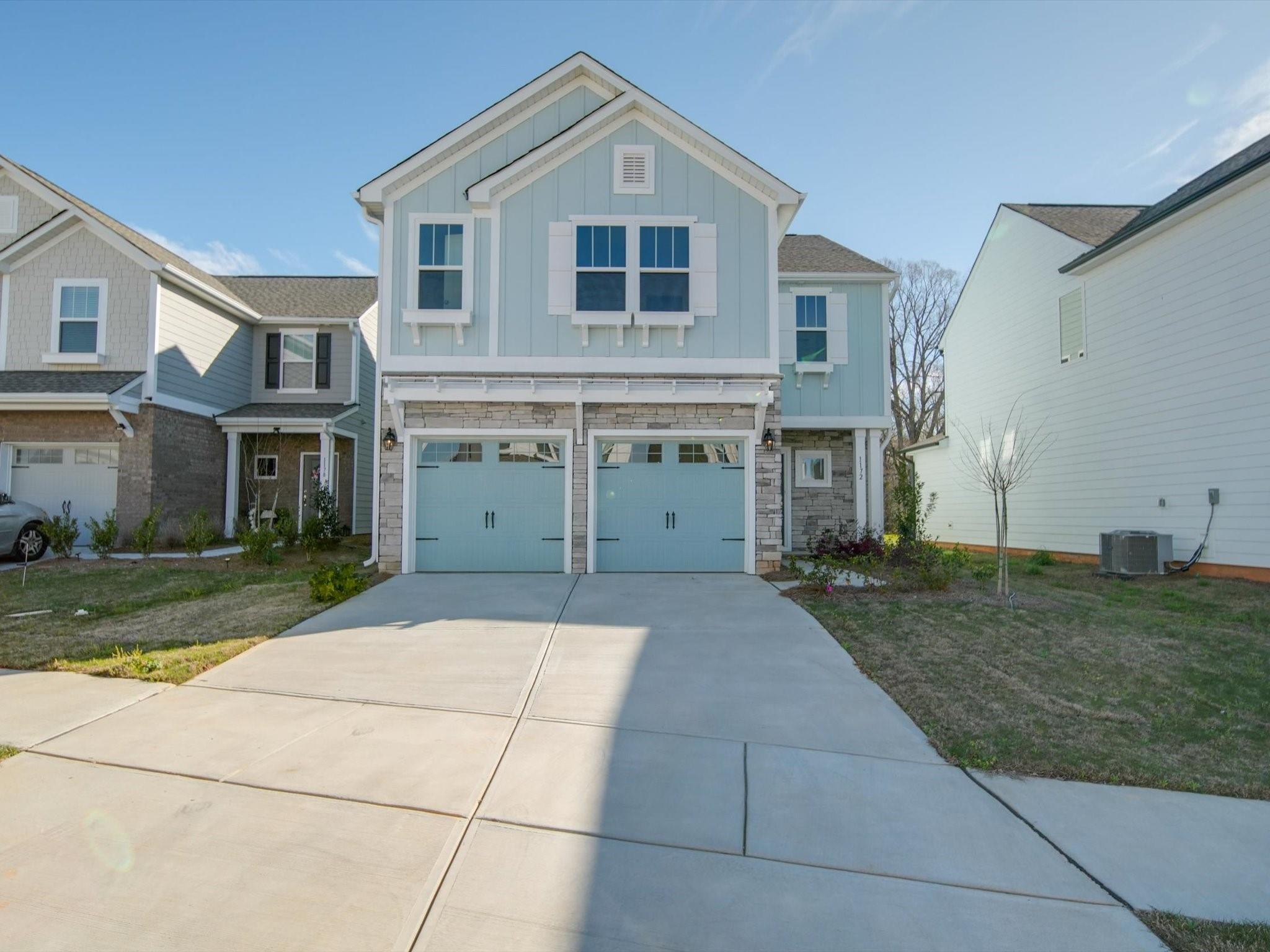 1172 Scotch Meadows Loop Monroe, NC 28110 - Photo 1 of 44 a front view of a house with garden