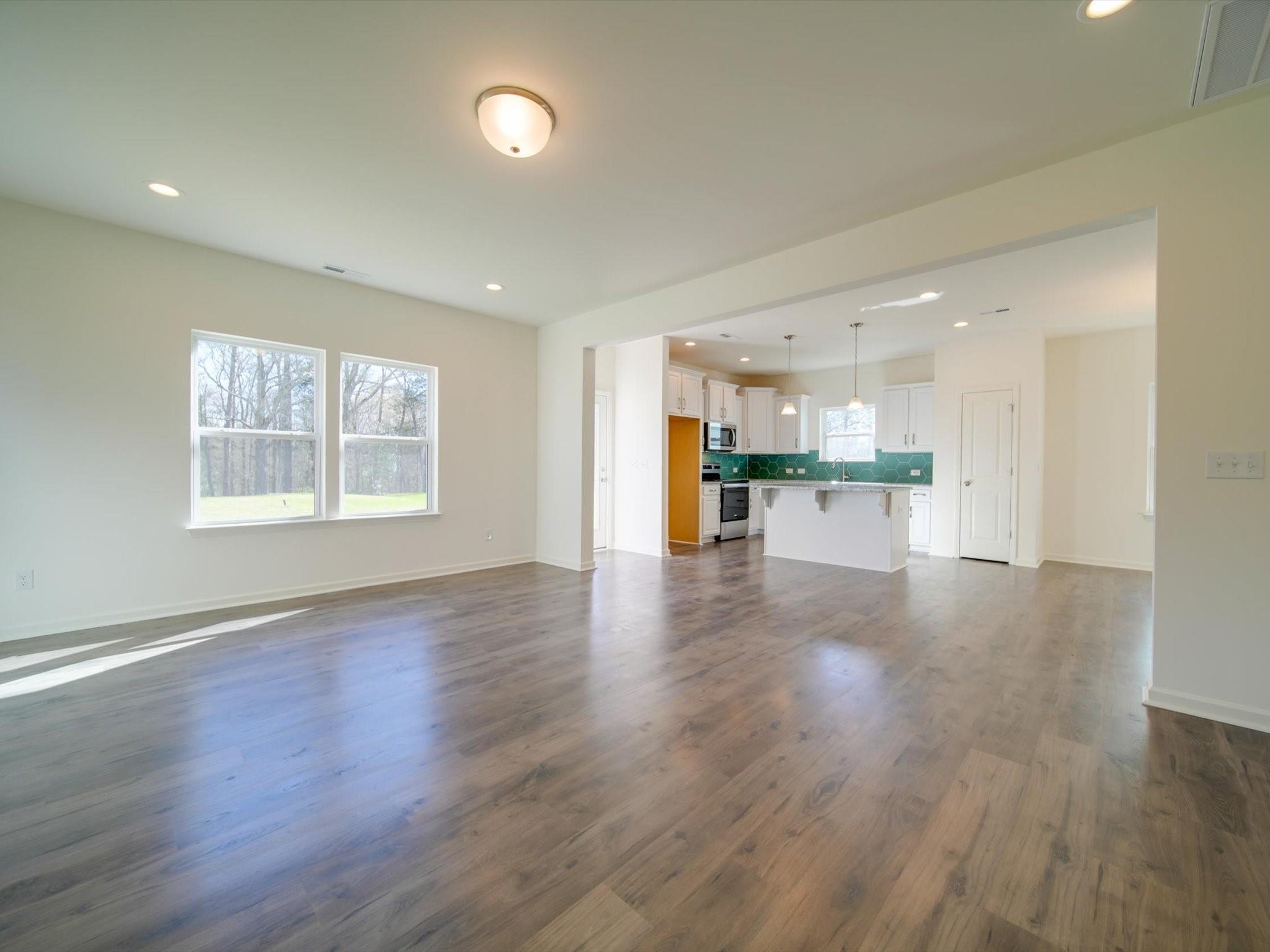 1172 Scotch Meadows Loop Monroe, NC 28110 - Photo 18 of 44 a view of kitchen with cabinets and wooden floor