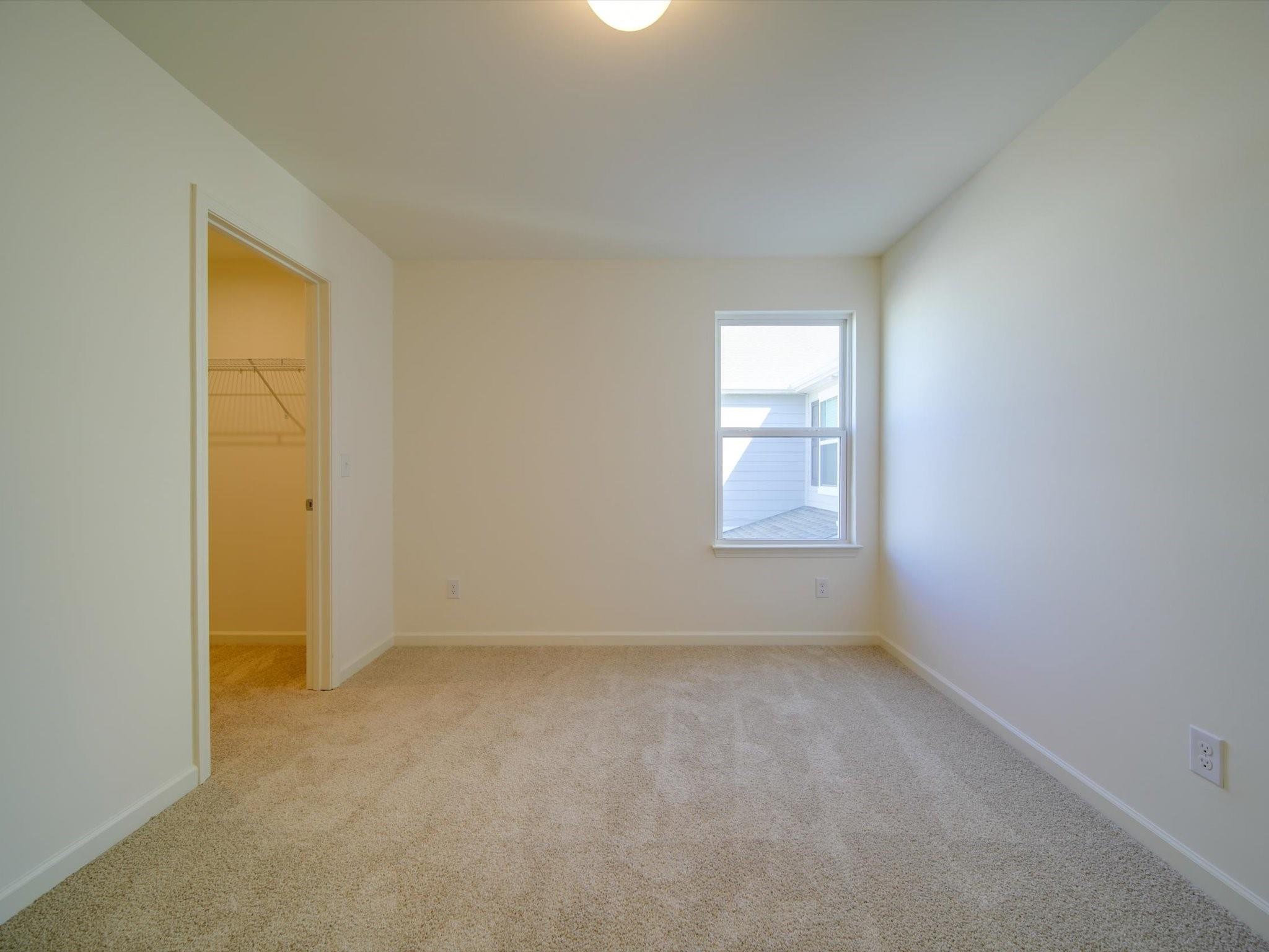 1172 Scotch Meadows Loop Monroe, NC 28110 - Photo 20 of 44 an empty room with a window