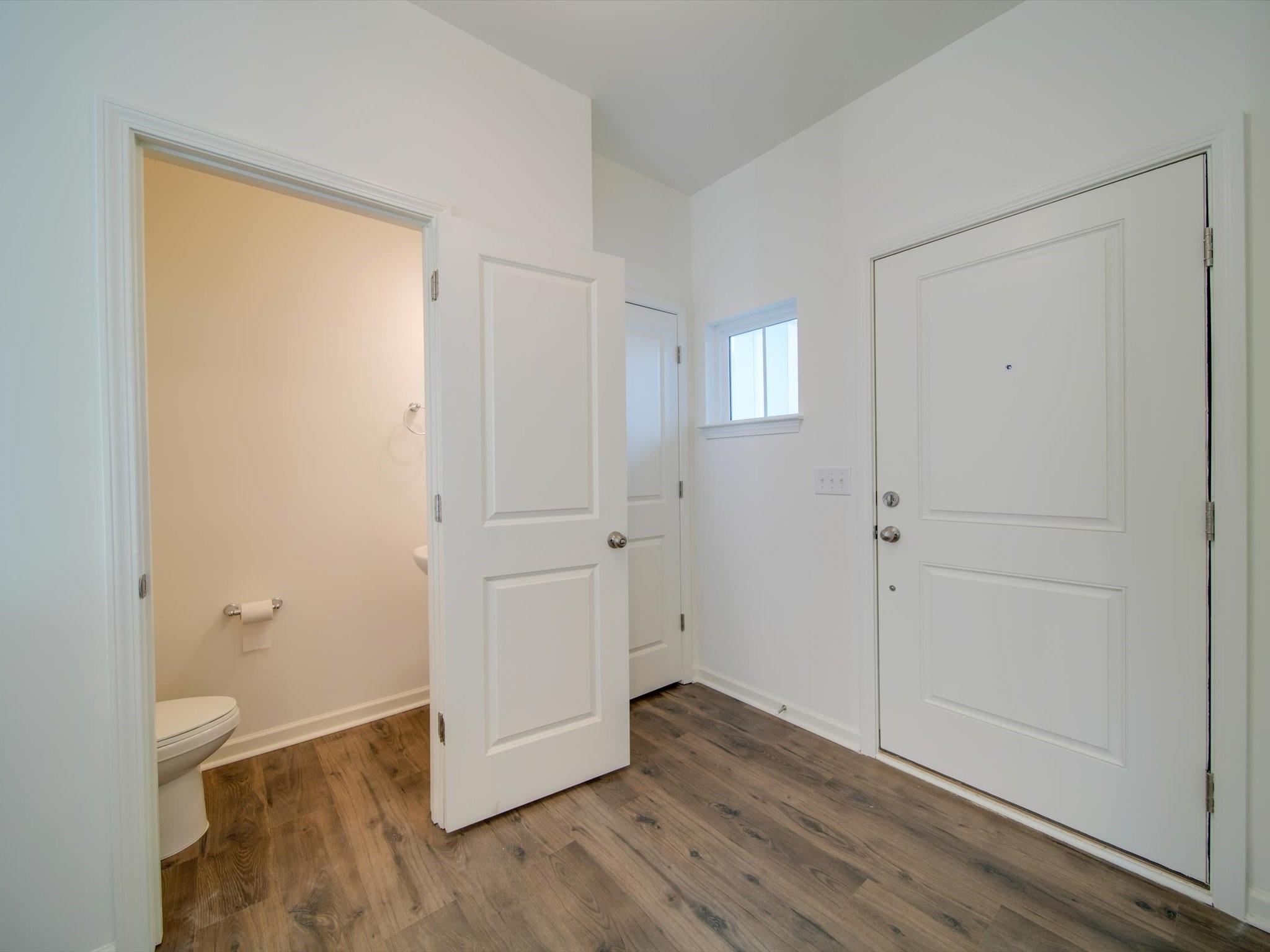 1172 Scotch Meadows Loop Monroe, NC 28110 - Photo 26 of 44 wooden floor in an empty room