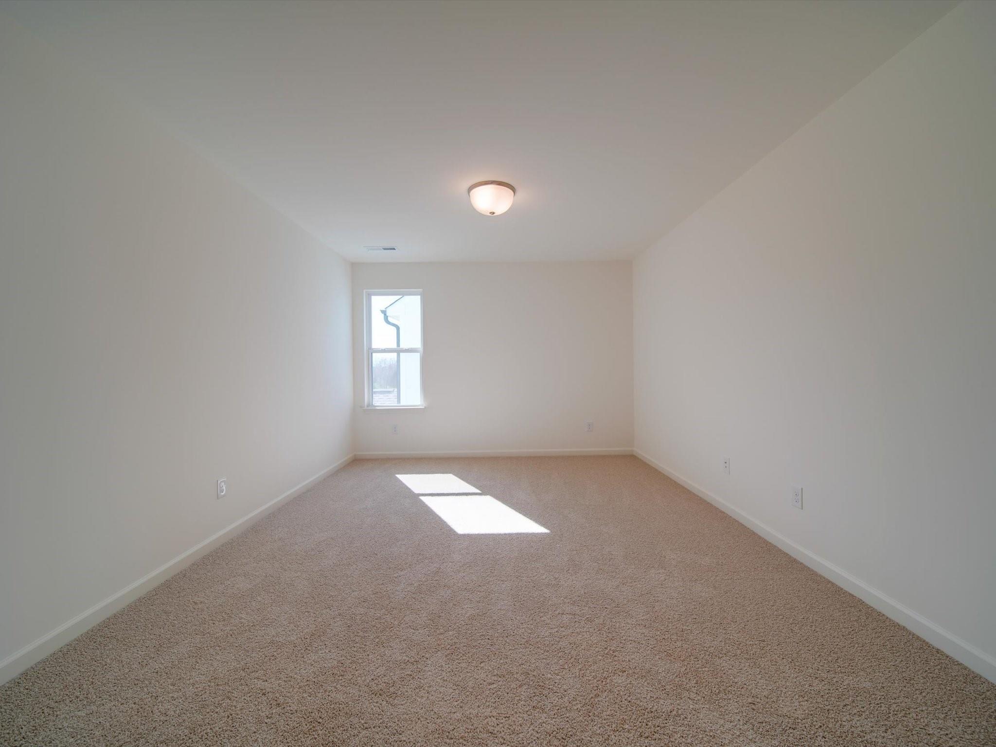 1172 Scotch Meadows Loop Monroe, NC 28110 - Photo 32 of 44 an empty room that has a window