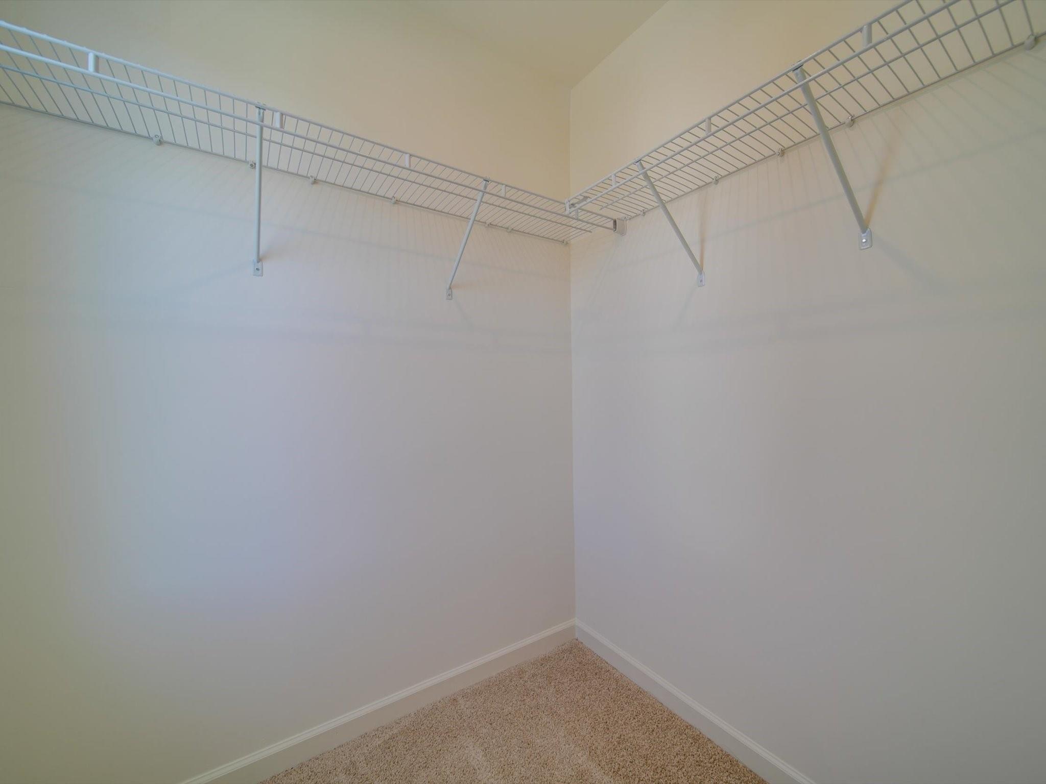 1172 Scotch Meadows Loop Monroe, NC 28110 - Photo 36 of 44 a view of a room with racks on the wall