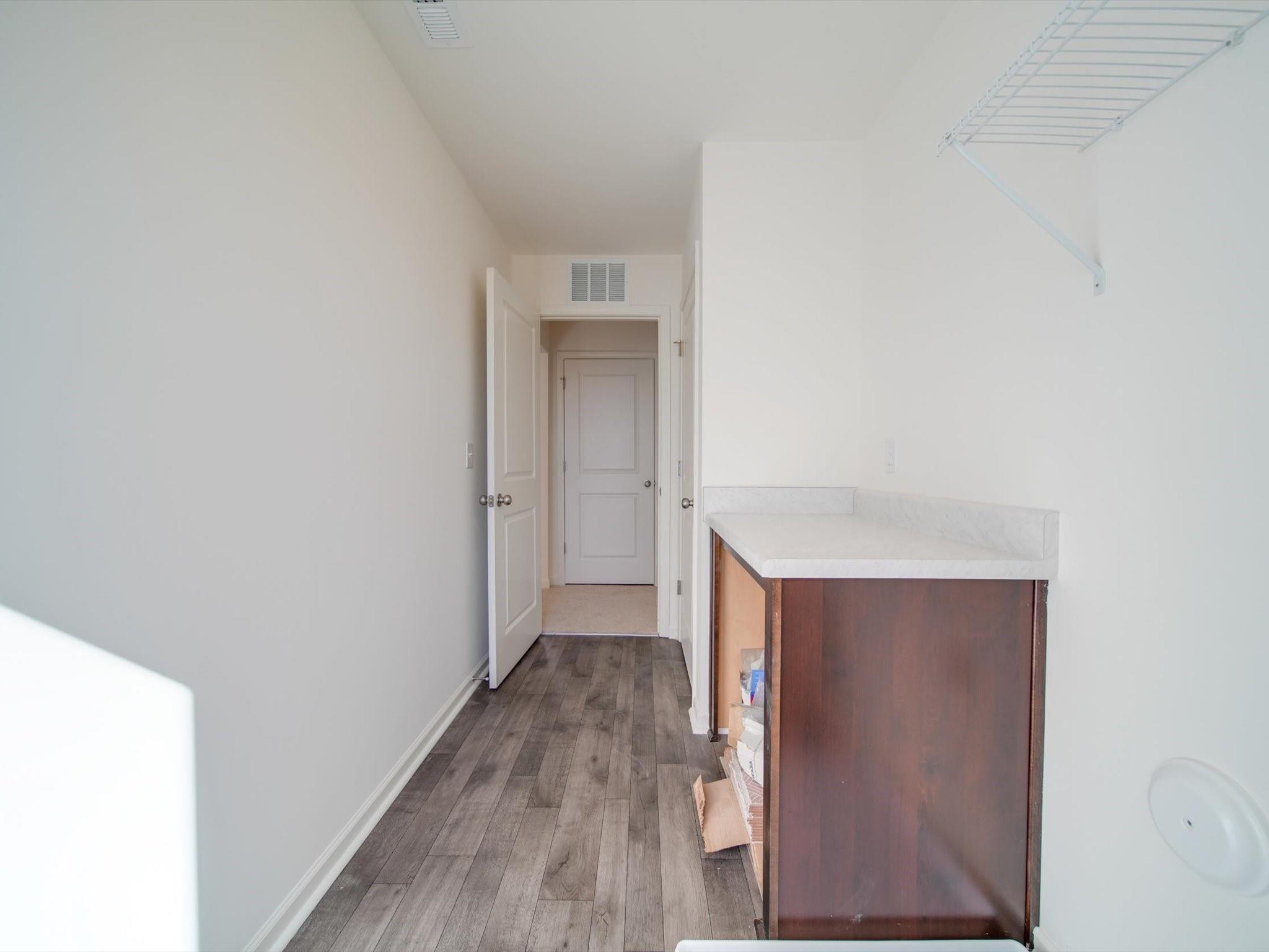 1172 Scotch Meadows Loop Monroe, NC 28110 - Photo 40 of 44 a view of hallway with wooden floor