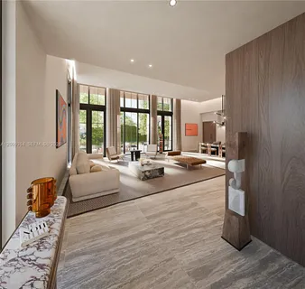a large room with a large window and furniture