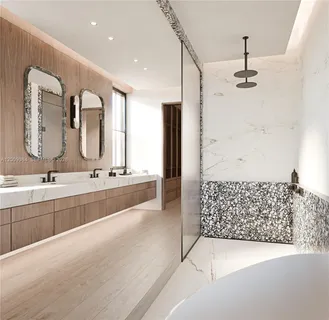 a bathroom with a double vanity sink a mirror and shower
