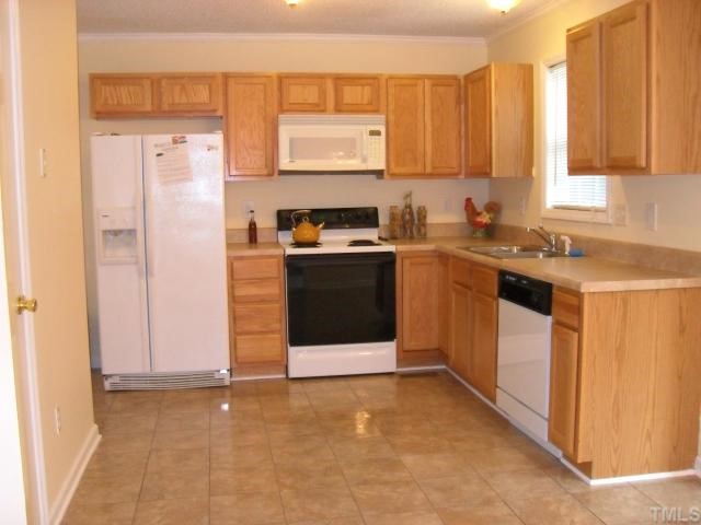 4 Round Spring Lane Durham, NC 27712 - Photo 5 of 10 Plenty of cabinets, new counter tops and floor in this roomy light filled kitchen. Also has a pantry and breakfast nook.