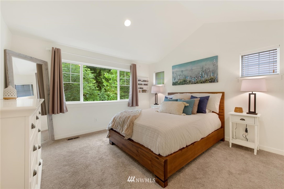 16203 41st Drive Southeast Bothell, WA 98012 - Photo 11 of 20 a bedroom with a bed and a large window