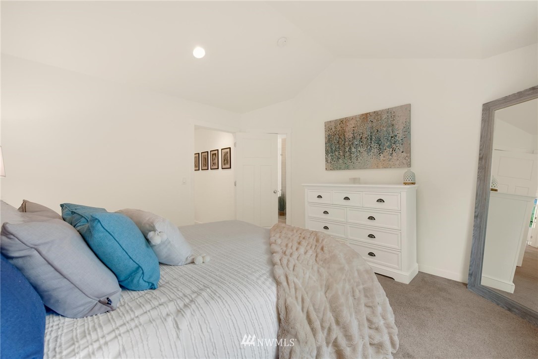 16203 41st Drive Southeast Bothell, WA 98012 - Photo 12 of 20 a bedroom with a bed and painting on the wall