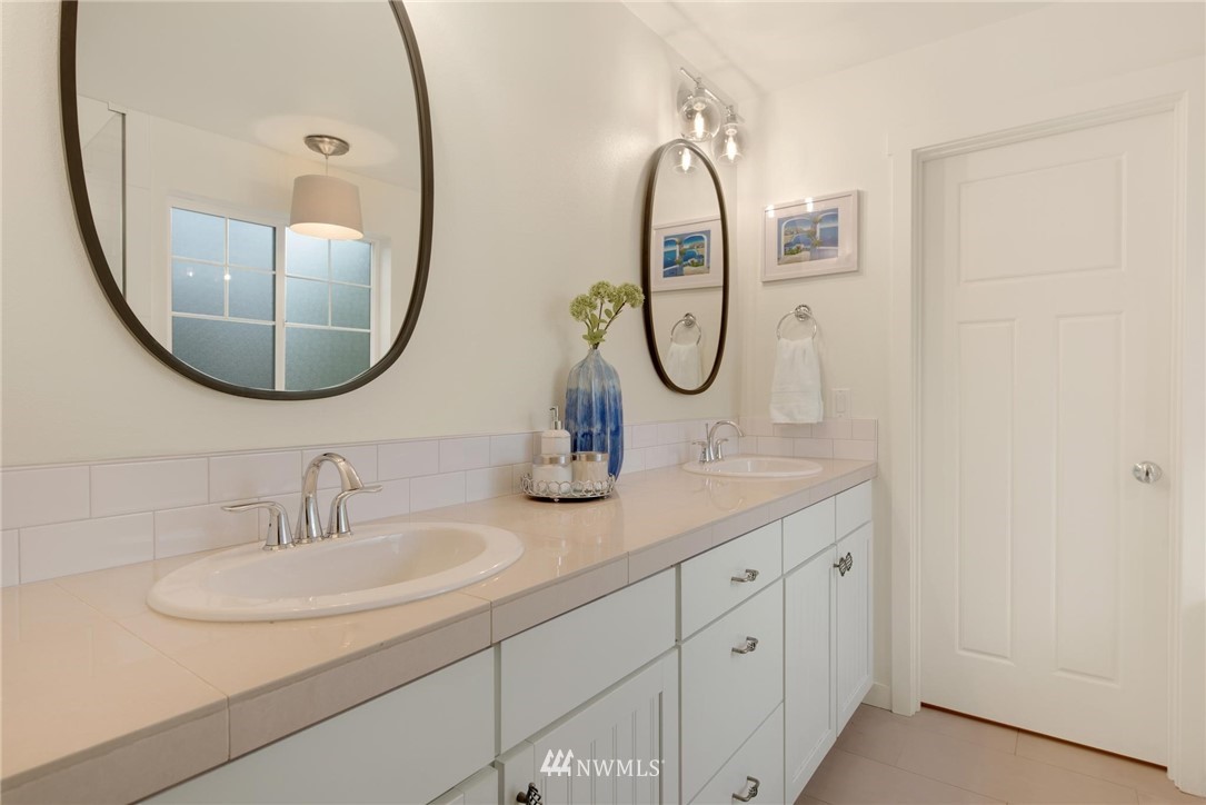 16203 41st Drive Southeast Bothell, WA 98012 - Photo 13 of 20 a bathroom with a sink and a mirror