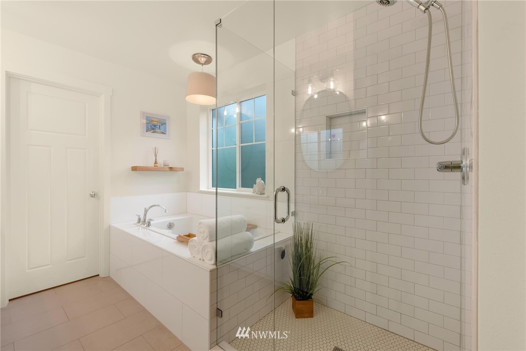 16203 41st Drive Southeast Bothell, WA 98012 - Photo 14 of 20 a bathroom with a tub a sink and shower