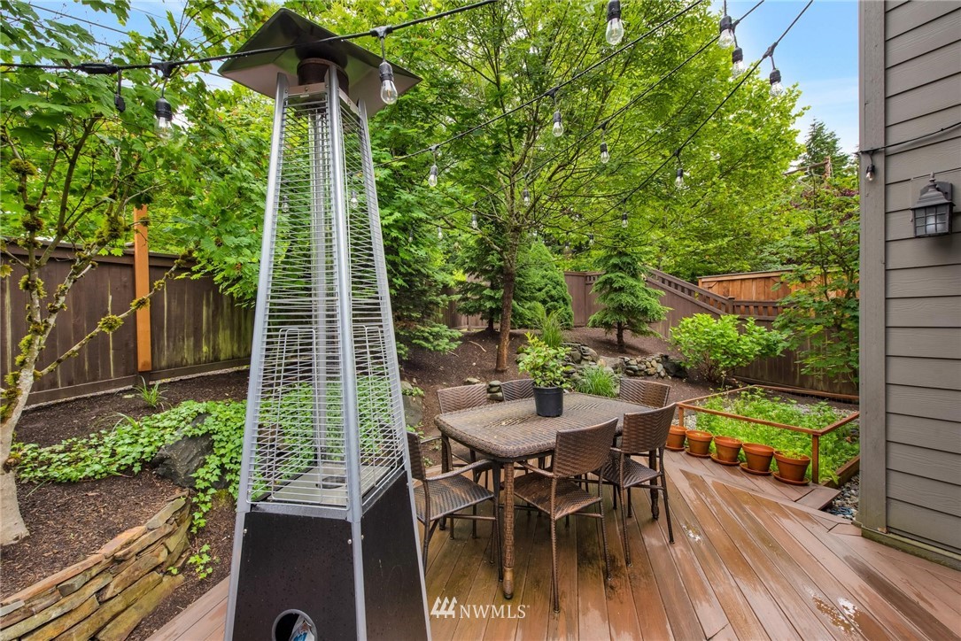 16203 41st Drive Southeast Bothell, WA 98012 - Photo 19 of 20 a patio with table and chairs and potted plants